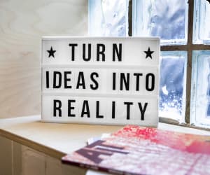 Board with the message - turn ideas into reality