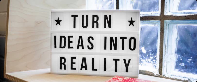 Board with the message - turn ideas into reality
