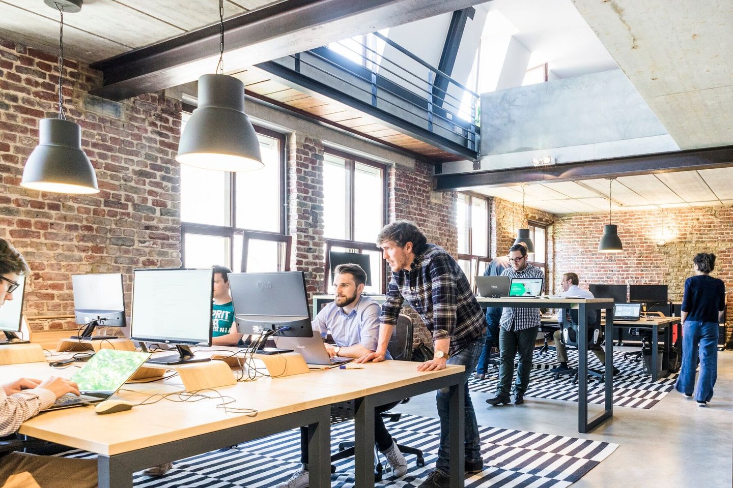 A team of young professionals working in a startup office.