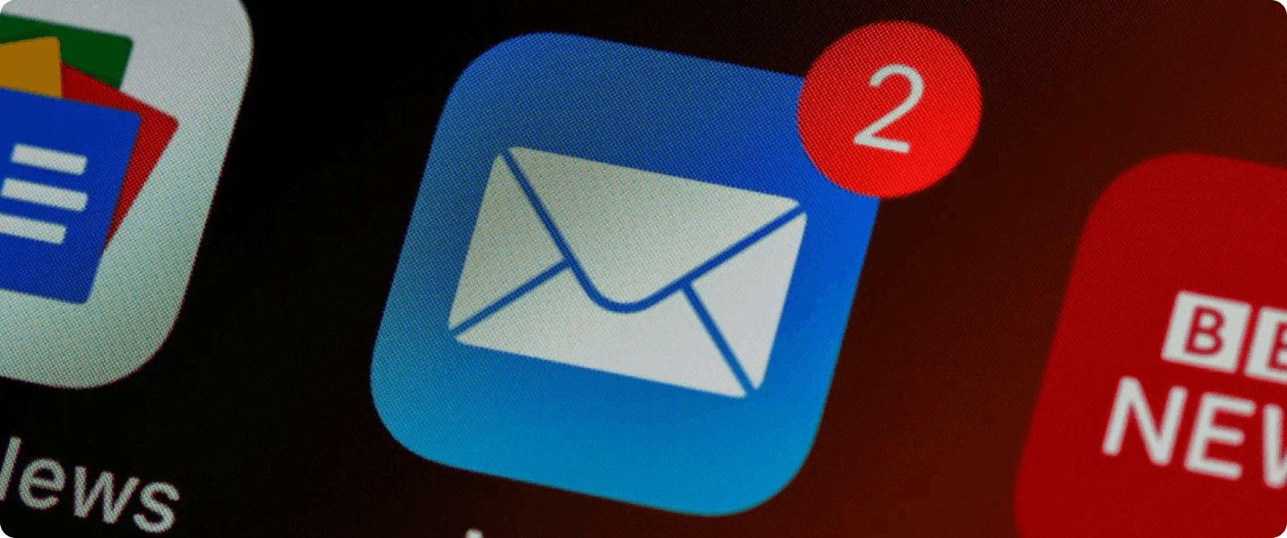A close-up of smartphone screen showing an email app icon with unread messages.