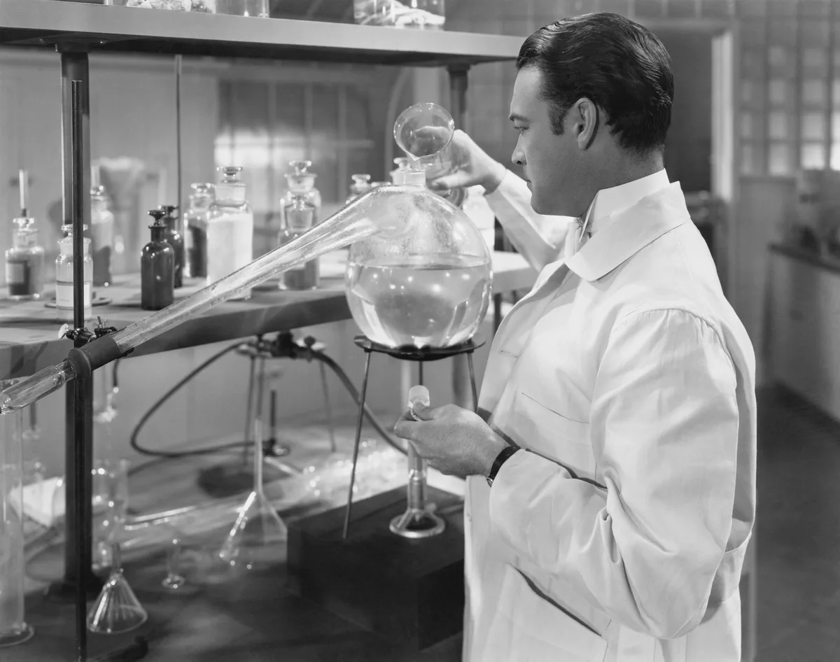 Scientist conducting an experiment, symbolizing the importance of testing different send times in marketing emails."