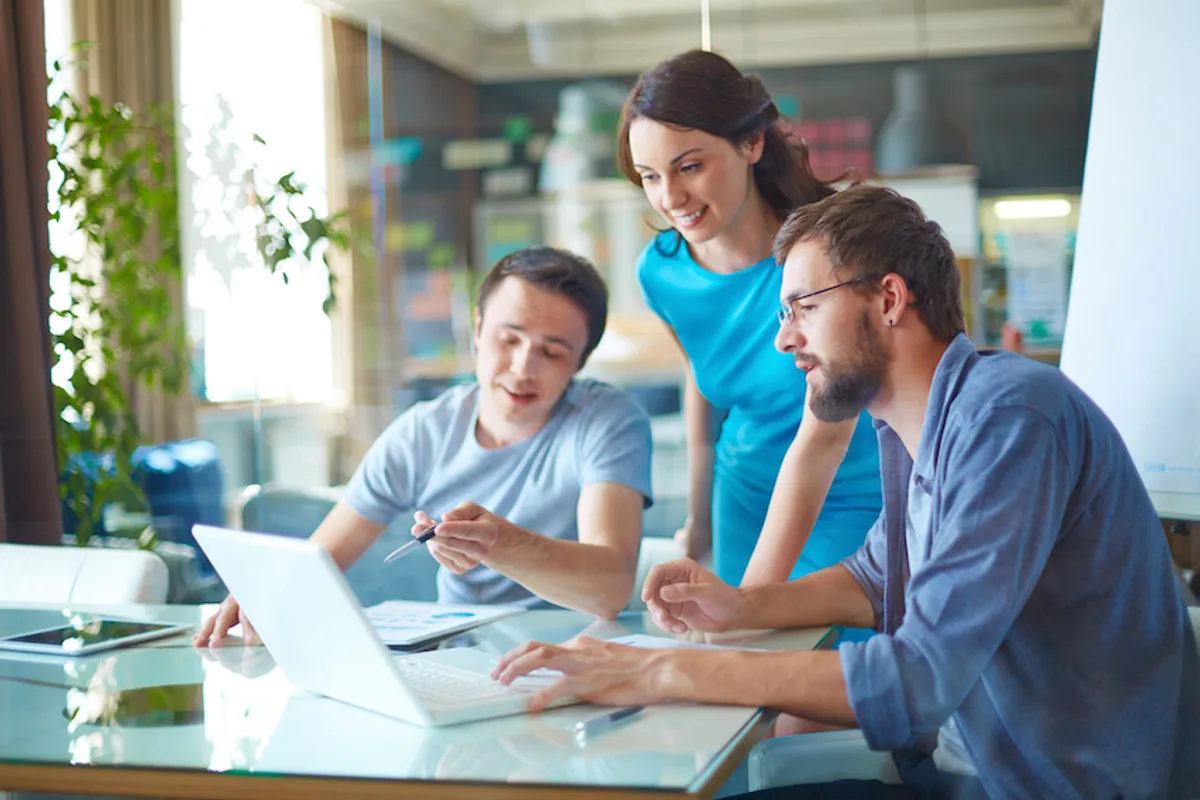 Young startup team discussing their b2b email marketing strategy in a modern office