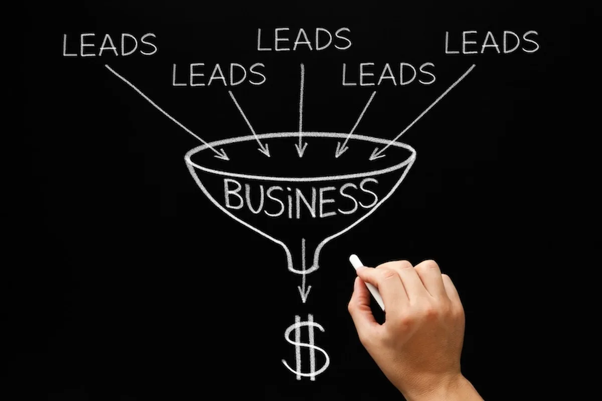 Chalk drawing of a funnel labeled 'Business' with 'LEADS' entering and a dollar sign at the exit, symbolizing lead conversion.