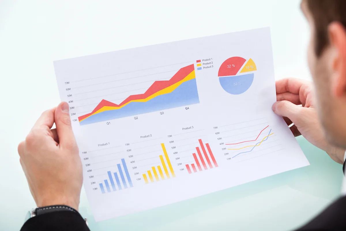 Business man looking at graph to illustrate High Return on investment and Cost-Effectiveness