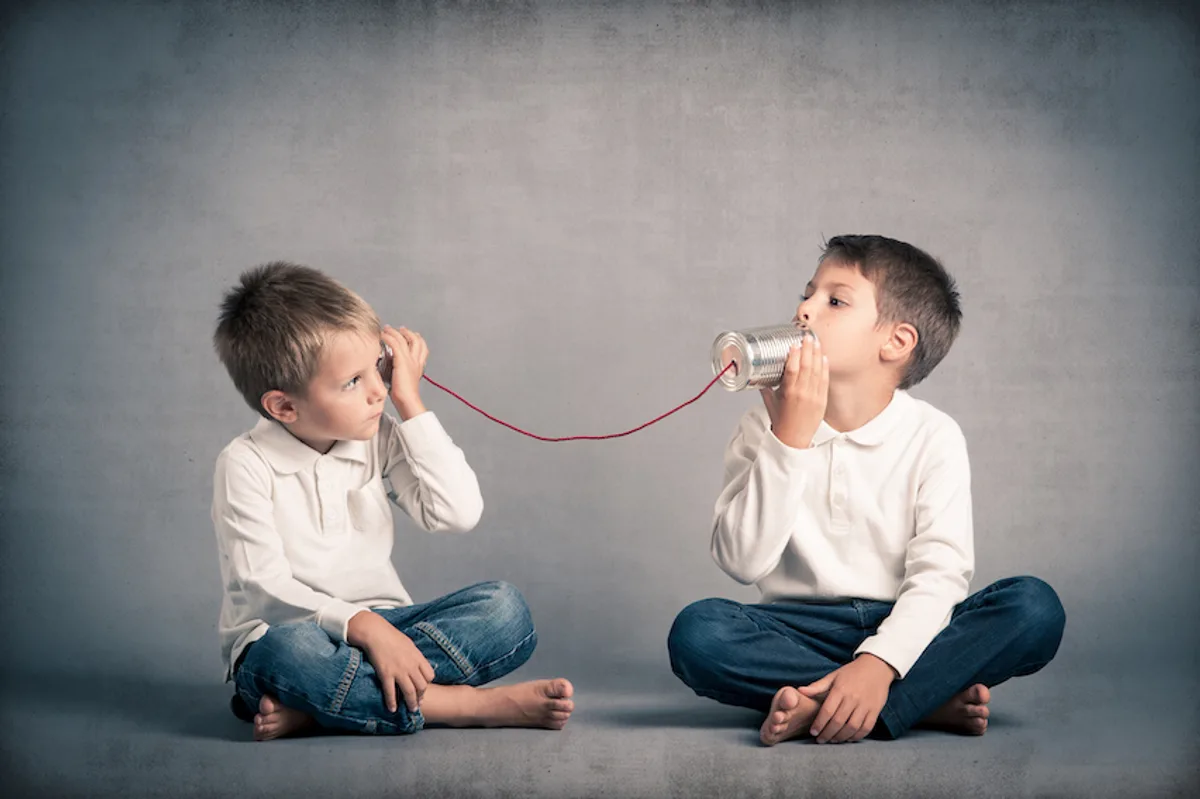 Two boys using tin cans and string to talk, illustrating a steady communication flow with email automation.