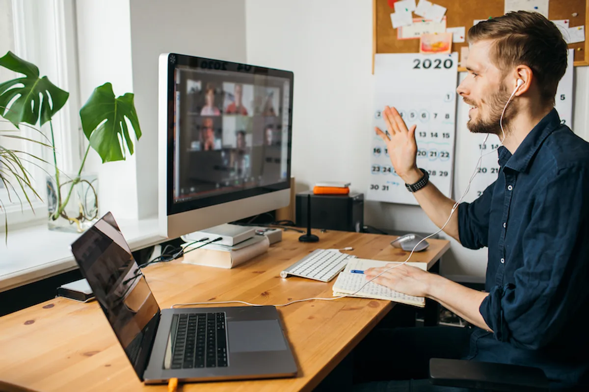 Founder in a video call with remote freelancers, highlighting effective management and communication from home.