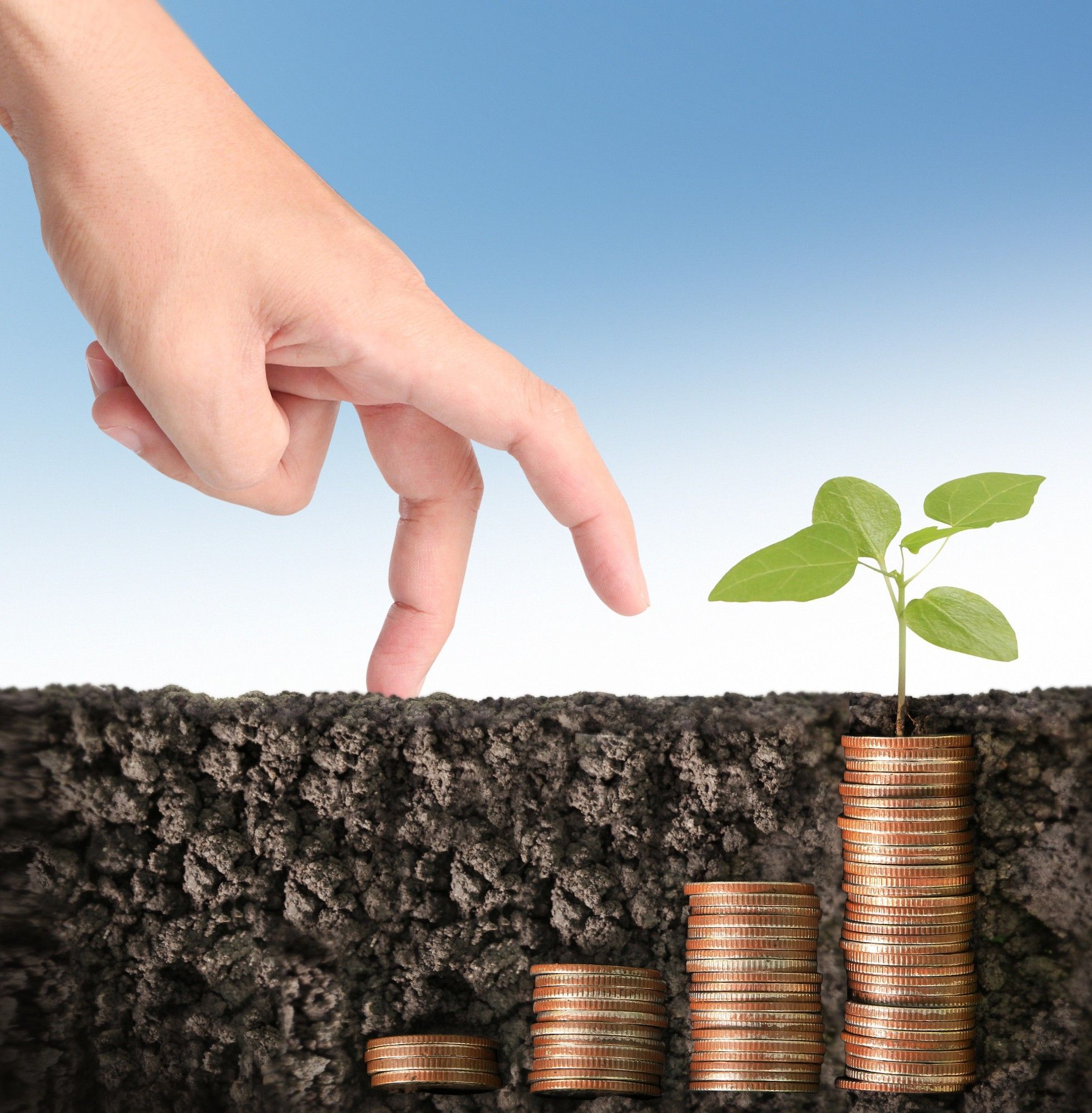 Hand walking up coin steps toward growing plant, illustrating gradual nurturing and educating of leads until ready to buy.